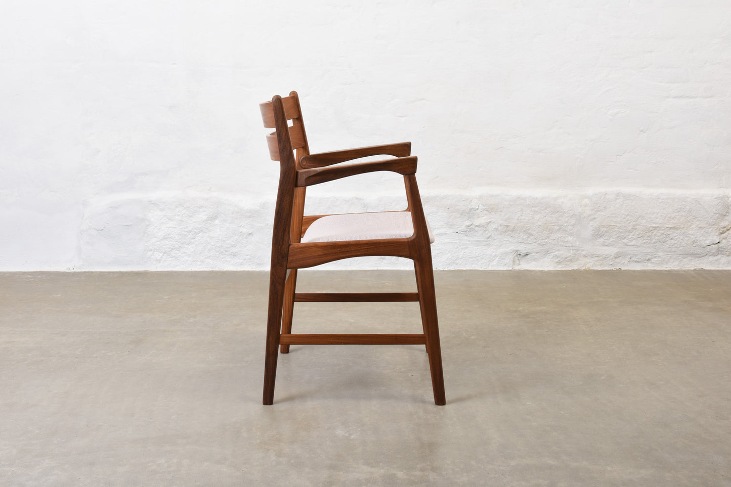 Newly upholstered: 1950s teak armchair