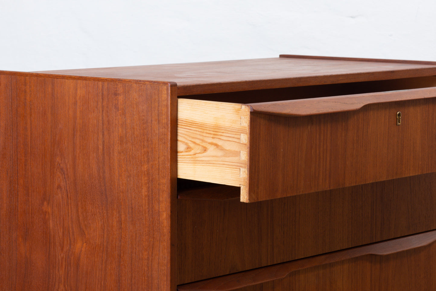 1960s low teak chest with lipped handles