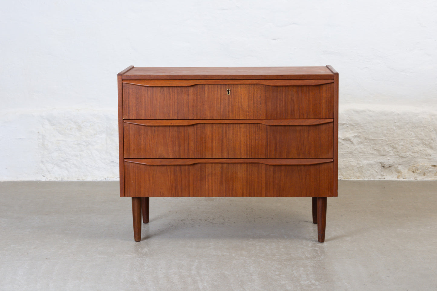 1960s low teak chest with lipped handles