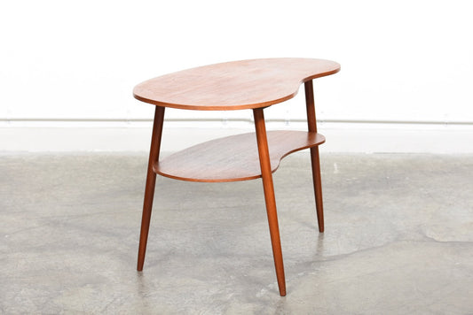 Organic side table in teak