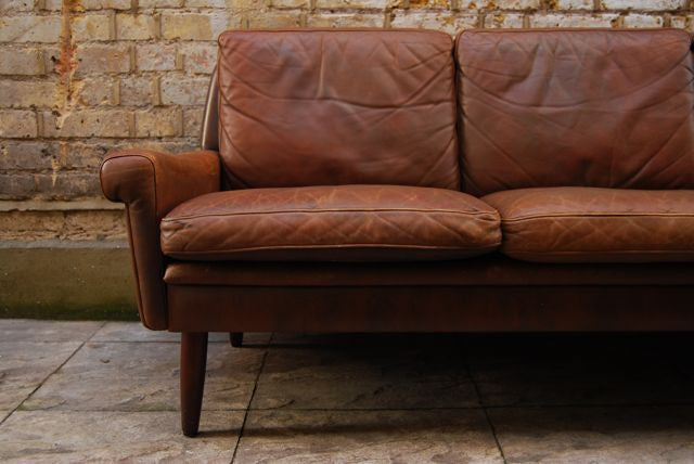 Brown three seat leather sofa by Skipper