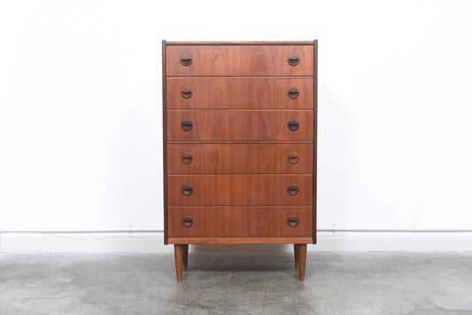 Tall teak chest of drawers