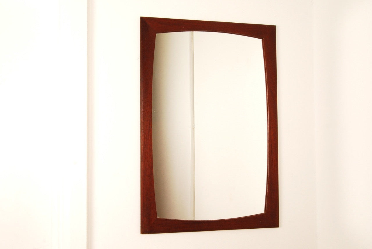 Mirror with curved frame