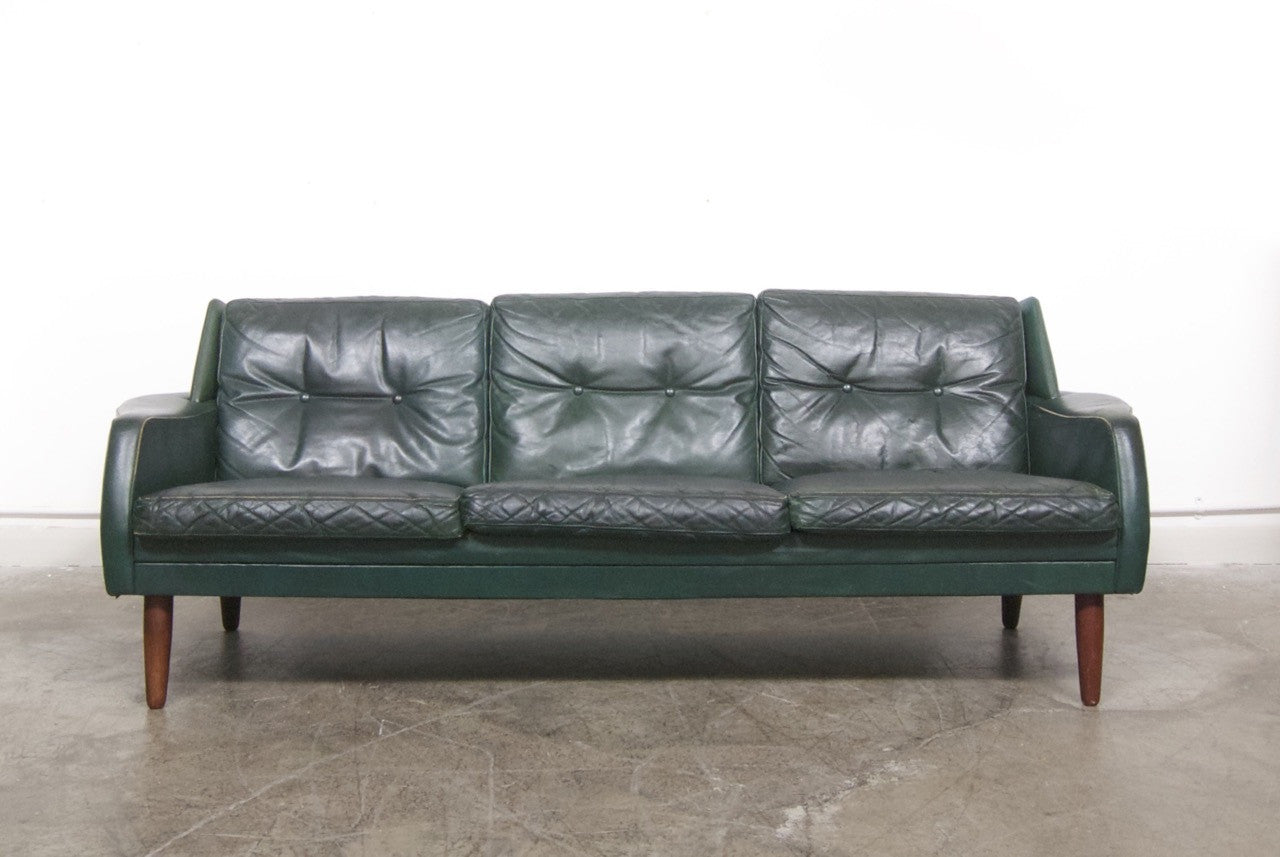 Dark green leather sofa