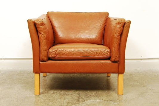 Tan leather club chair