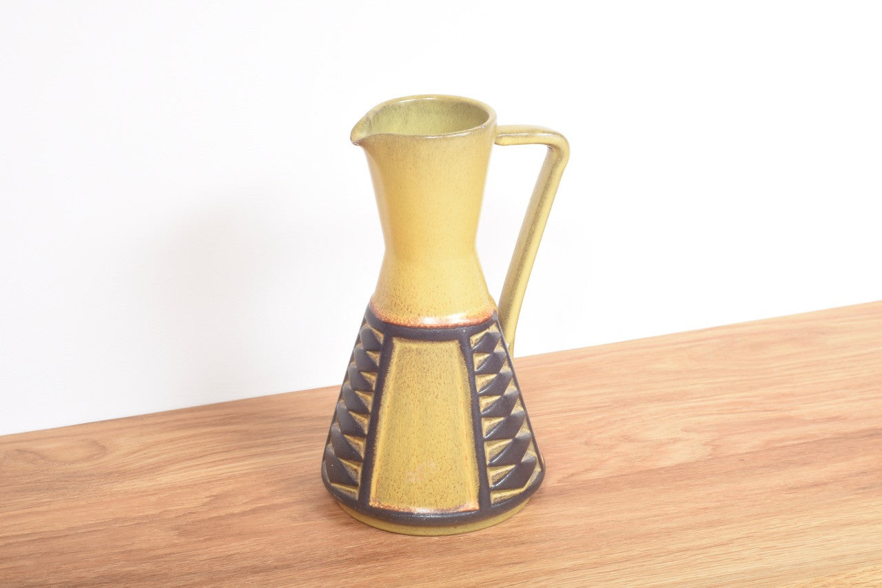 Ceramic pitcher with mustard glaze