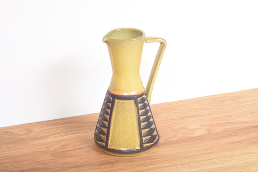 Ceramic pitcher with mustard glaze