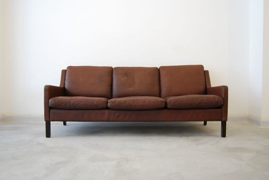 Three seat leather sofa by George Thams