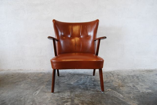 Leather occasional chair in teak