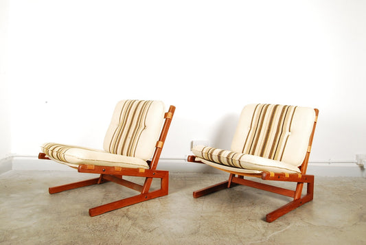 Pair of low loungers in teak