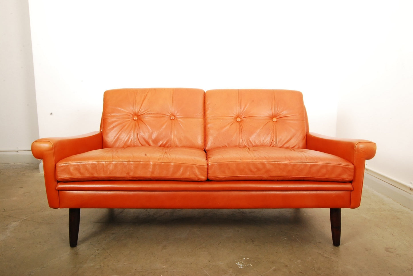 Two seat leather sofa by Skipper