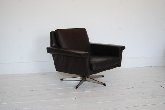 Leather lounge chair on swivel base