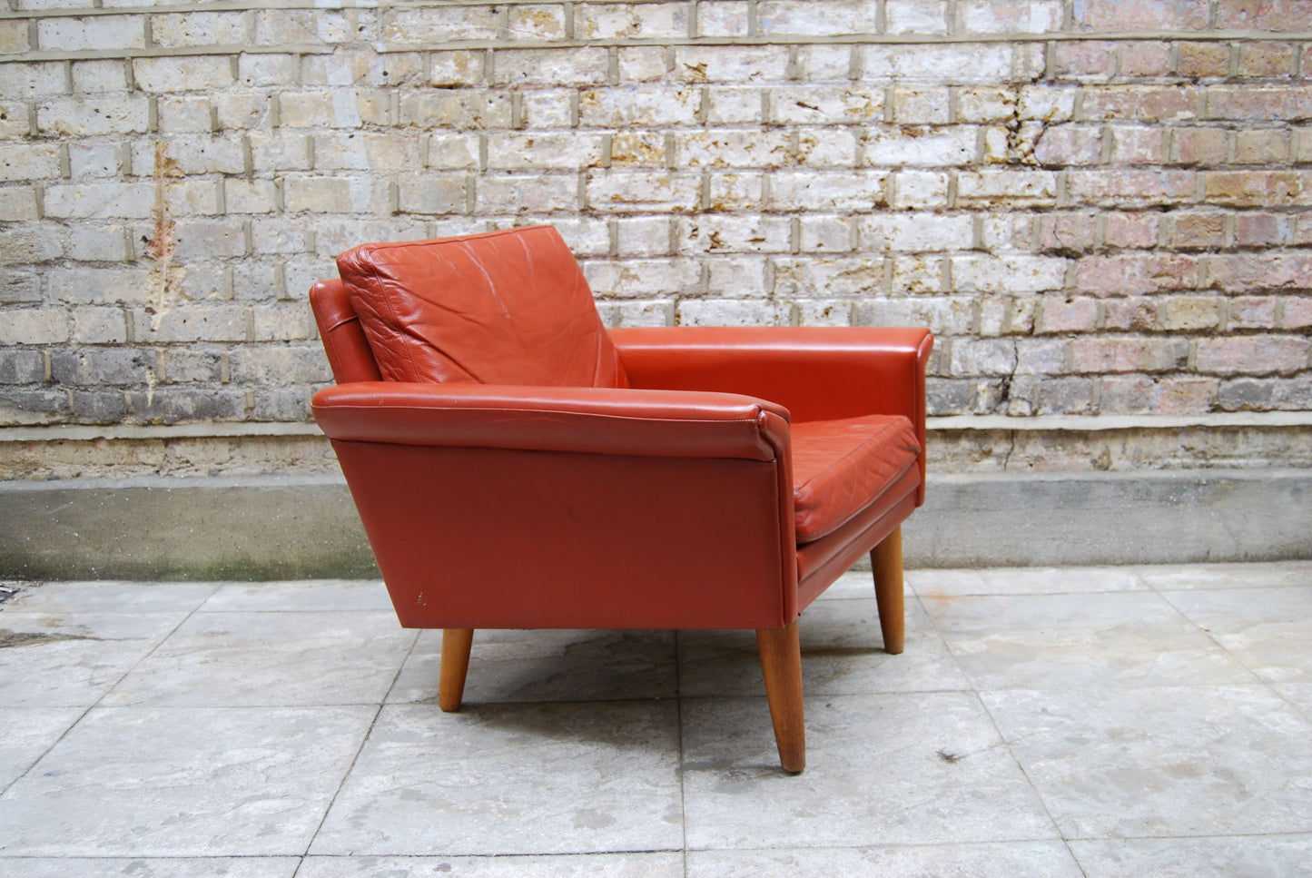 Lowback lounge chair in red leather