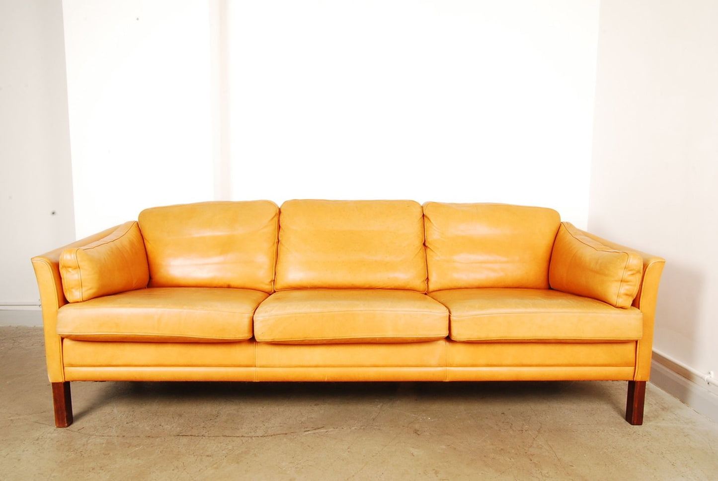 Three seat tan leather sofa