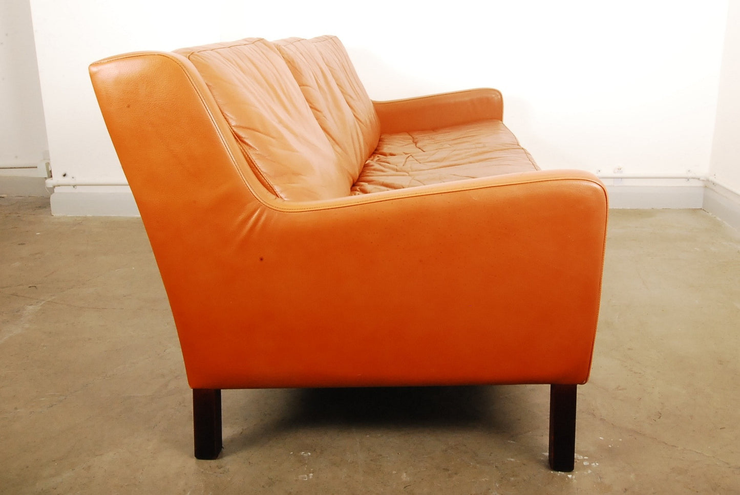 Three seat tan leather sofa