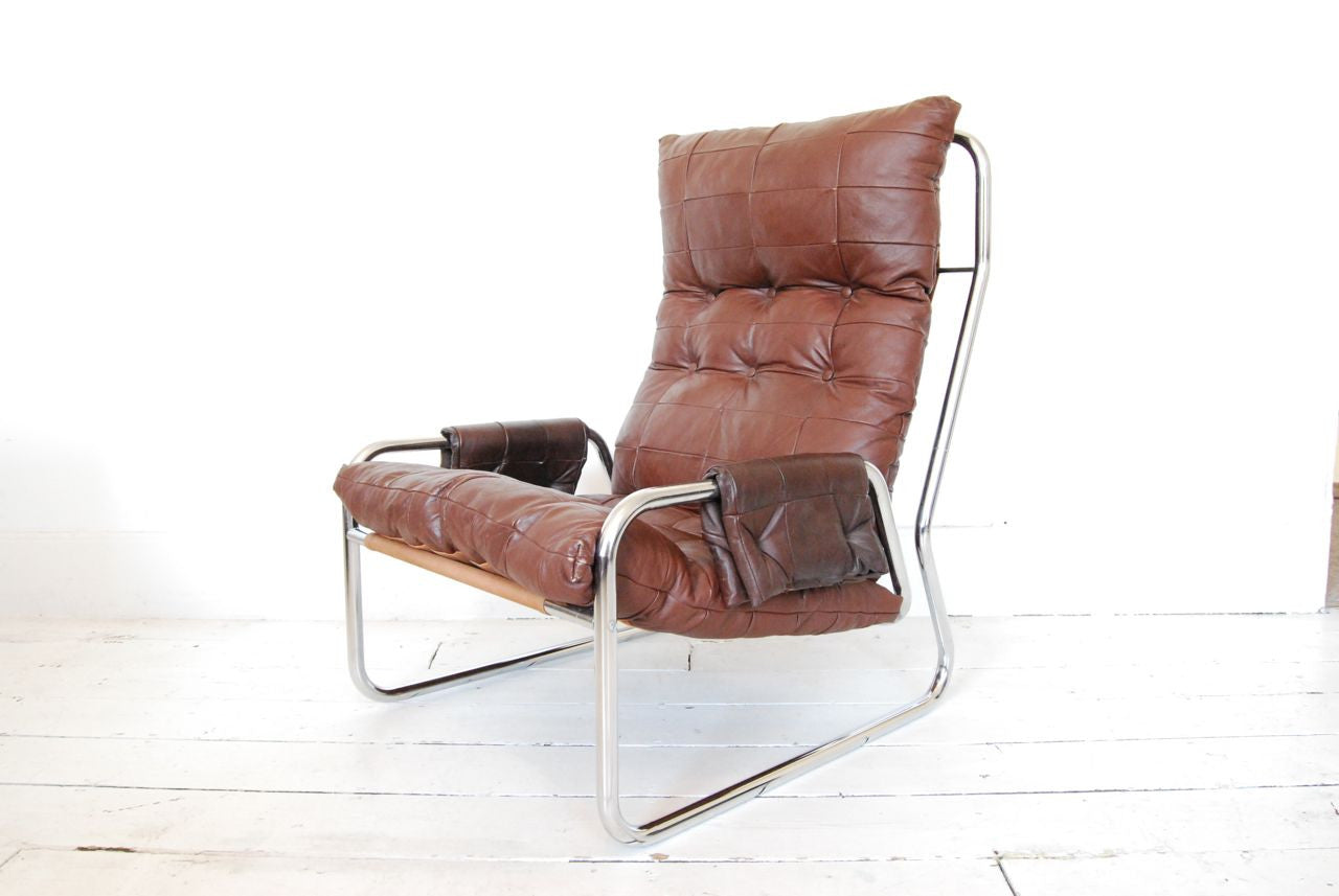Lounge chair in leather, canvas and chrome base