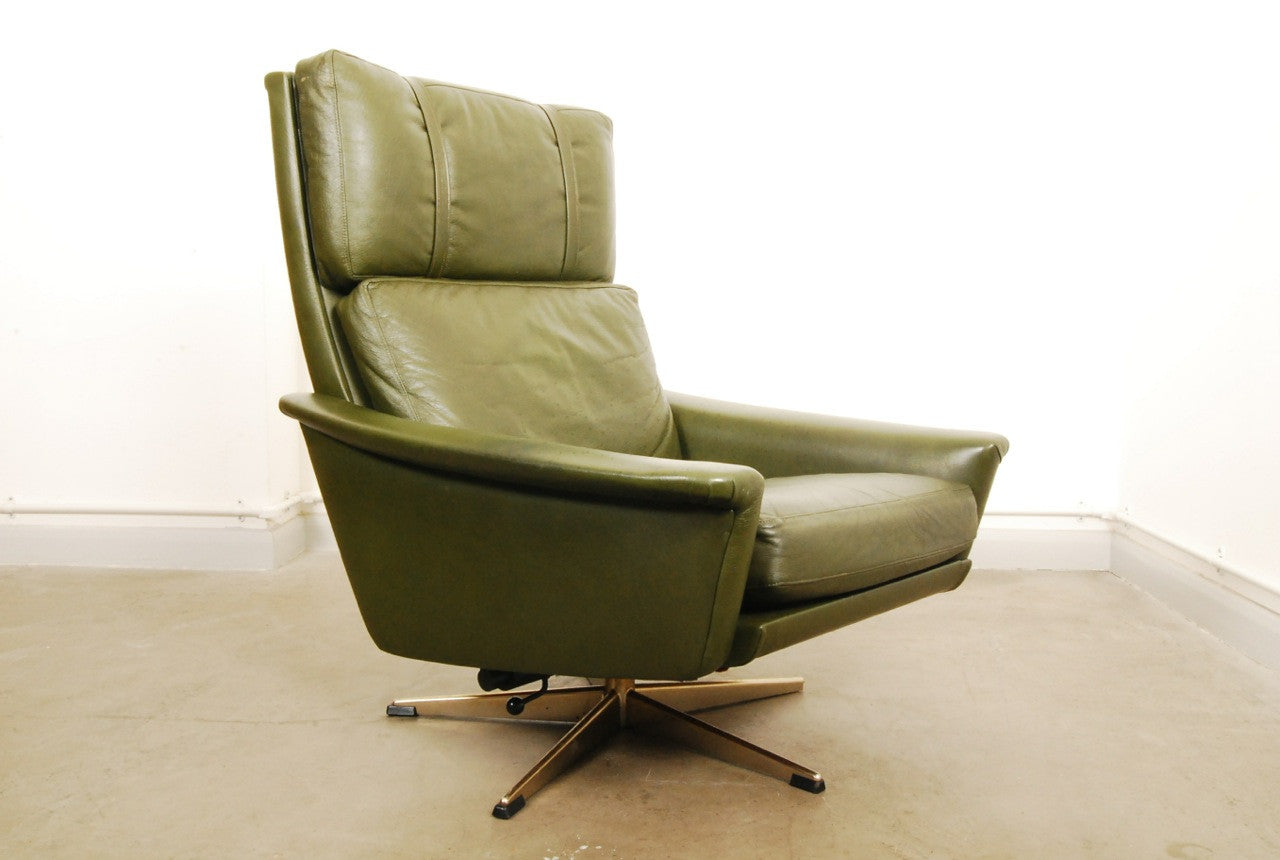 Reclining leather chair on swivel base