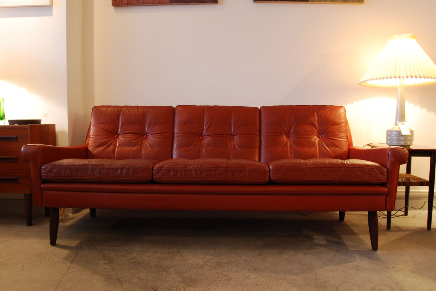 Three seat sofa in red leather