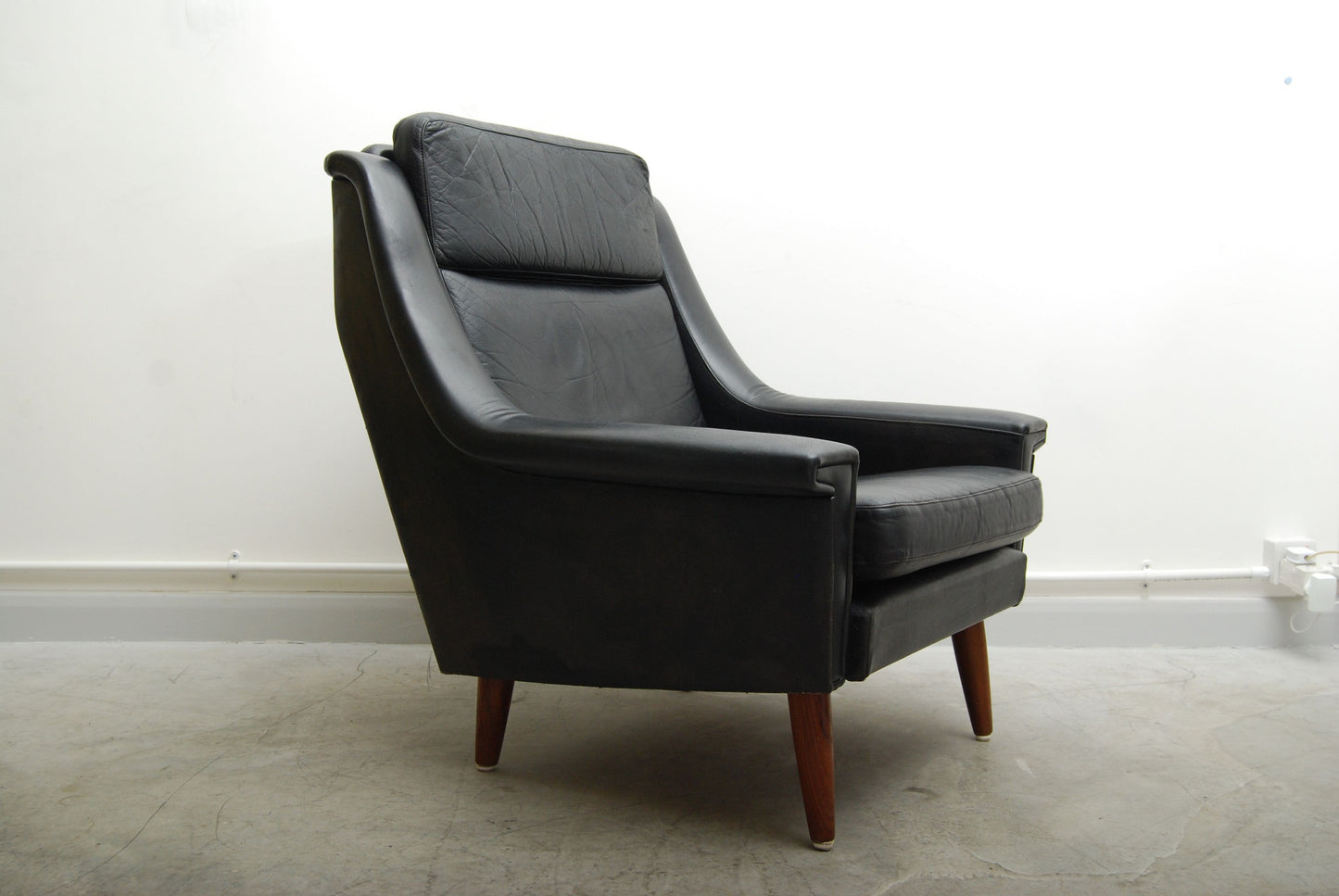 New price: Black leather lounge chair
