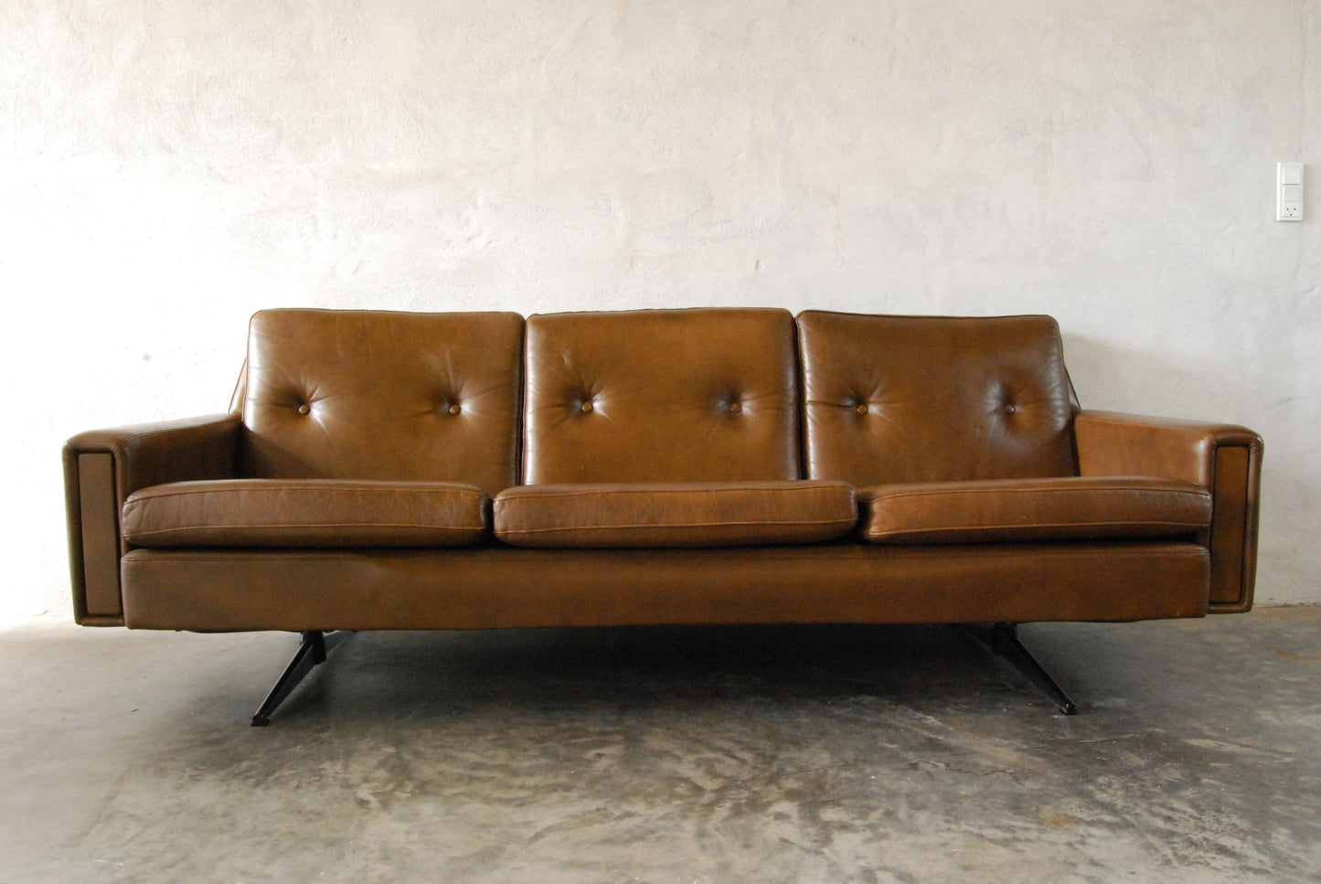Leather three seater with chrome base