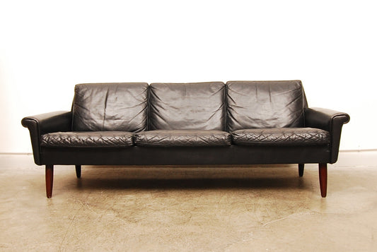 Three seat jet black leather sofa