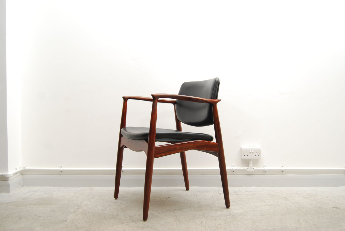 Rosewood armchair by Eric Buch