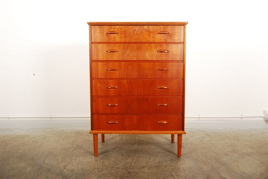 Teak chest of six drawers on oak legs