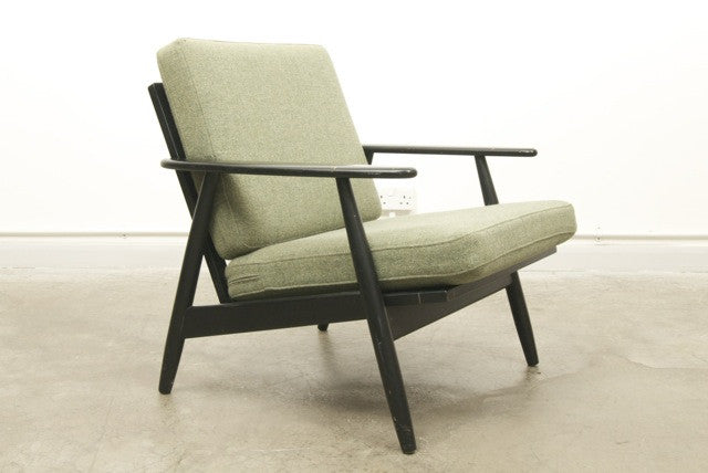 Low back ebonised lounge chair