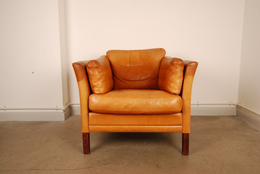 Tan leather club chair