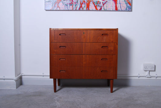 Short chest of four drawers with inset handles