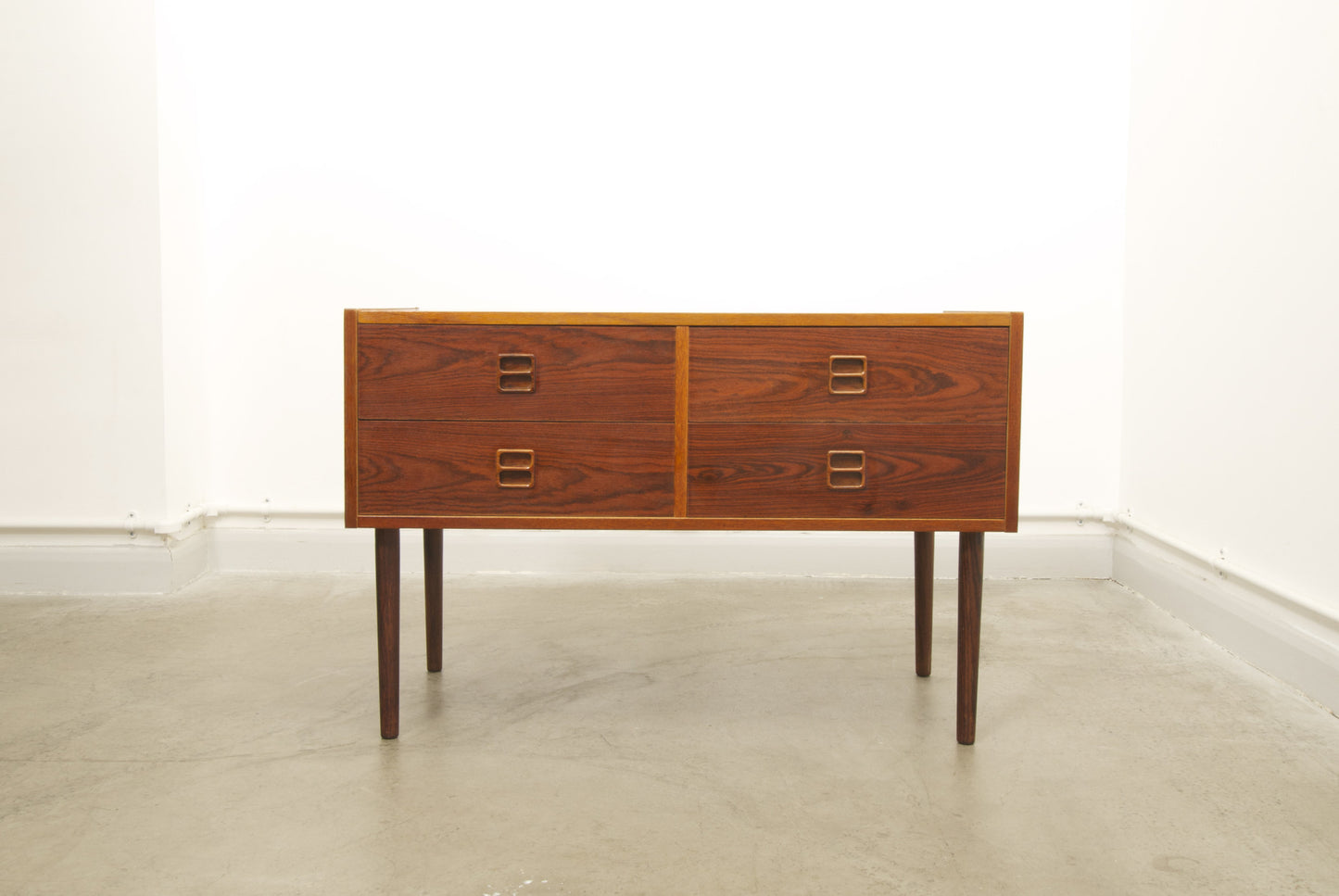 Low chest of drawers in rosewood