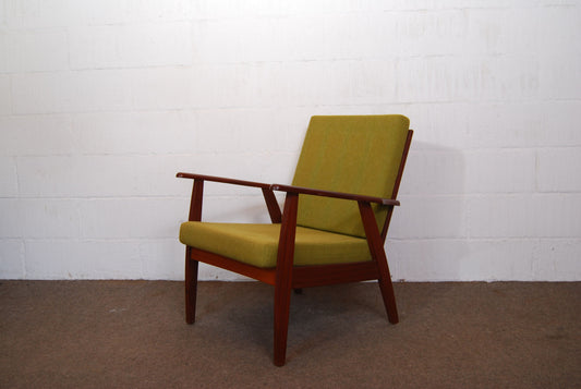 Teak lounge chair with grass green cushions