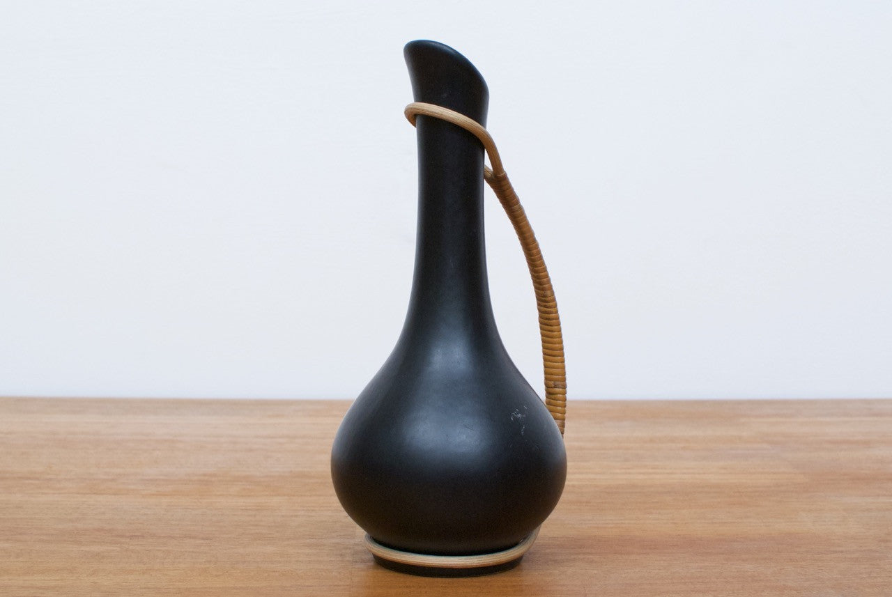 Black ceramic bud vase with cane handle