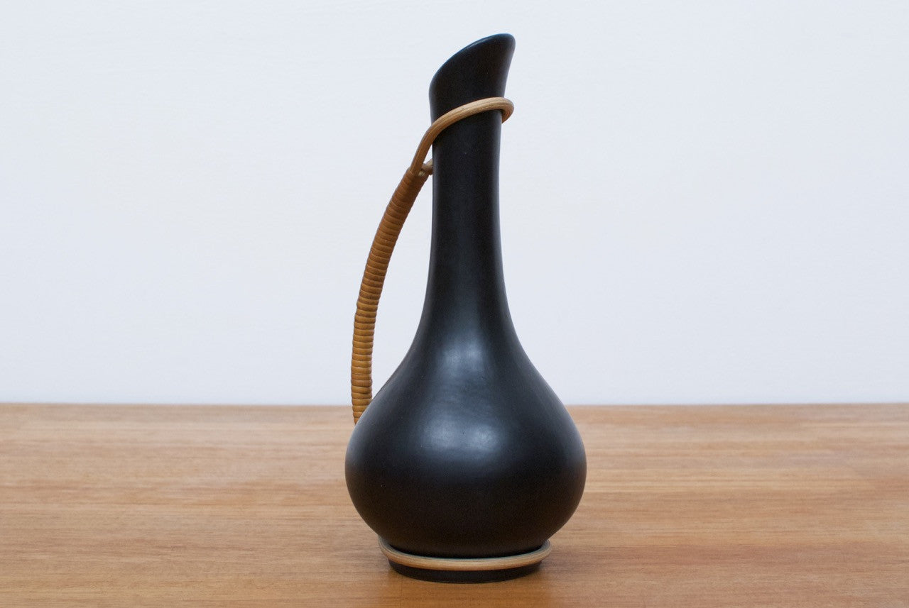 Black ceramic bud vase with cane handle
