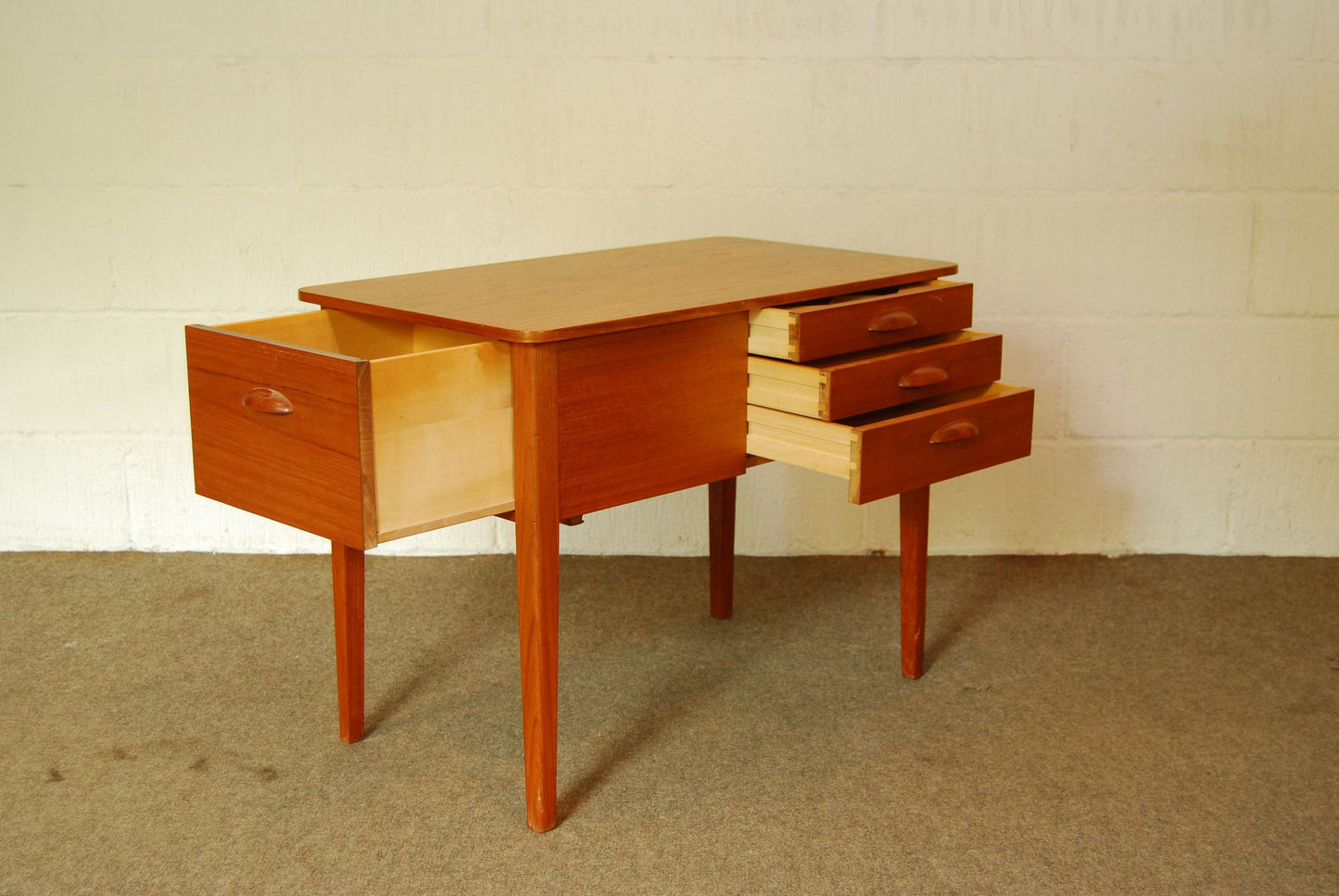Birch-lined teak sewing table