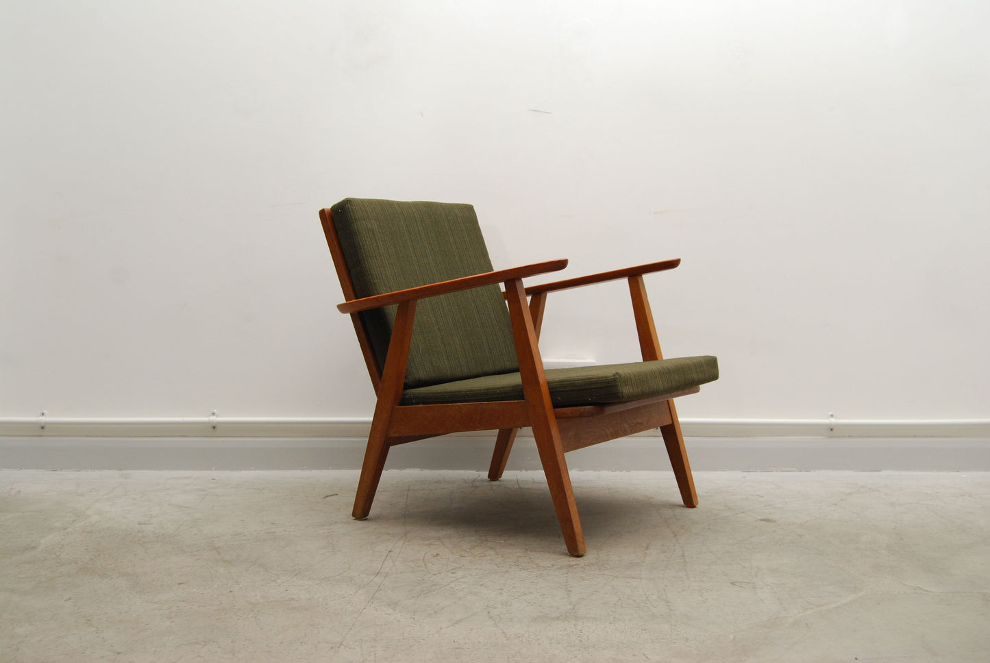 Teak lounge chair with forest green cushions