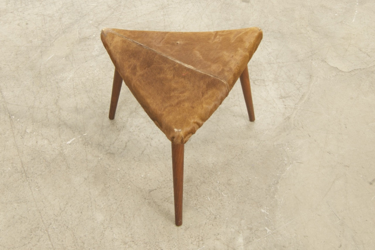 Foot stool with cow hide covering