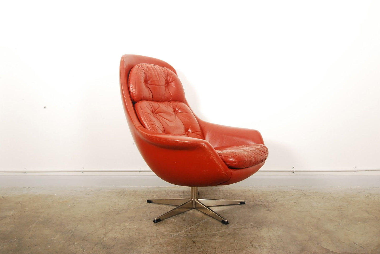 Red leather bucket chair by H.W. Klein