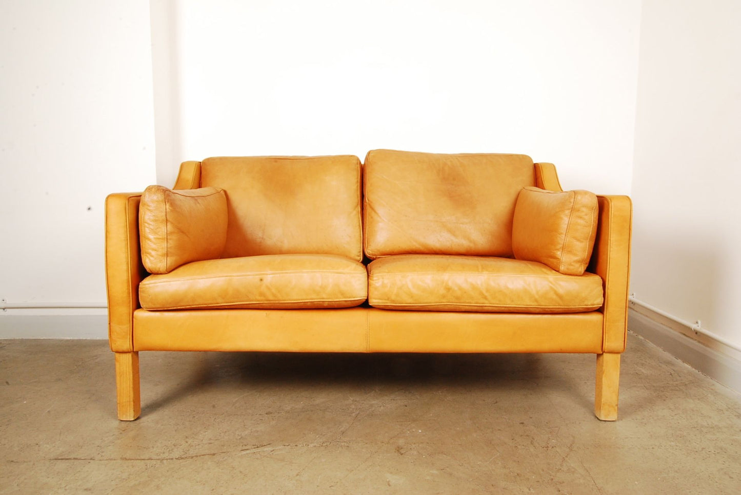 Tan two seat leather sofa