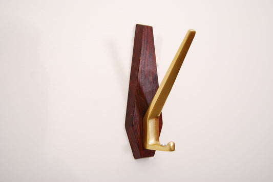 Set of three rosewood and brass coat hangers