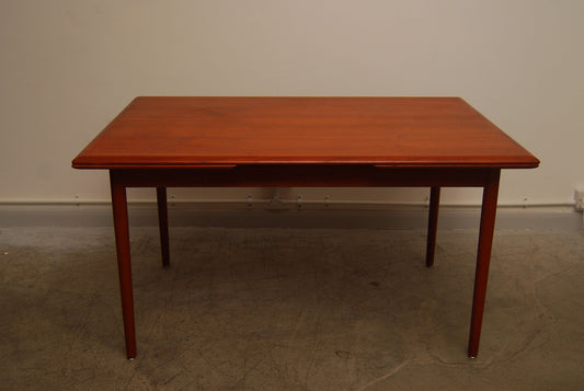 Extending teak dining table