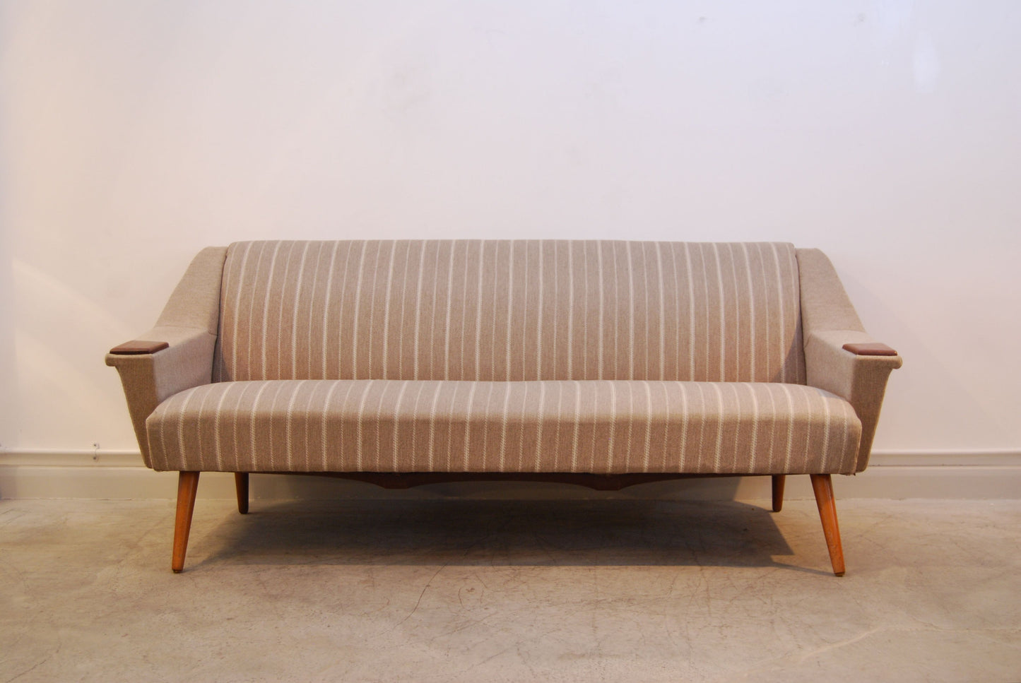 Three seat sofa with teak paws and legs