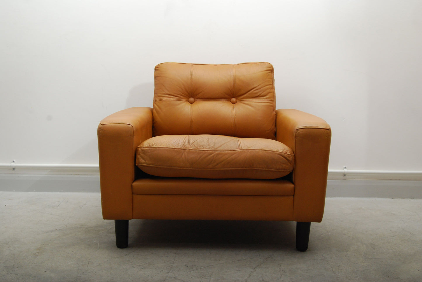 Caramel leather lowback lounge chair
