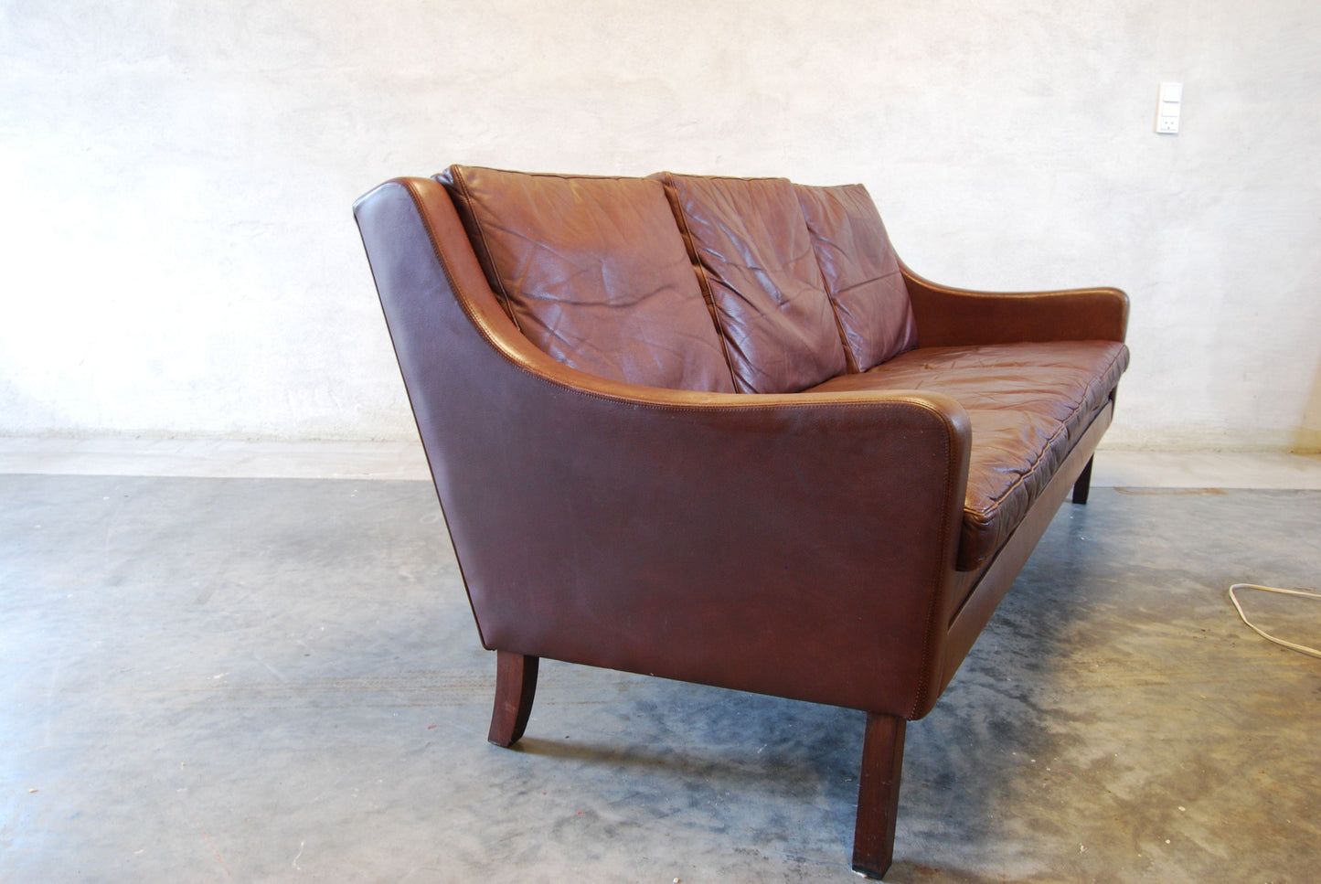 Brown leather three seater