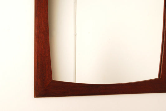 Mirror with curved frame