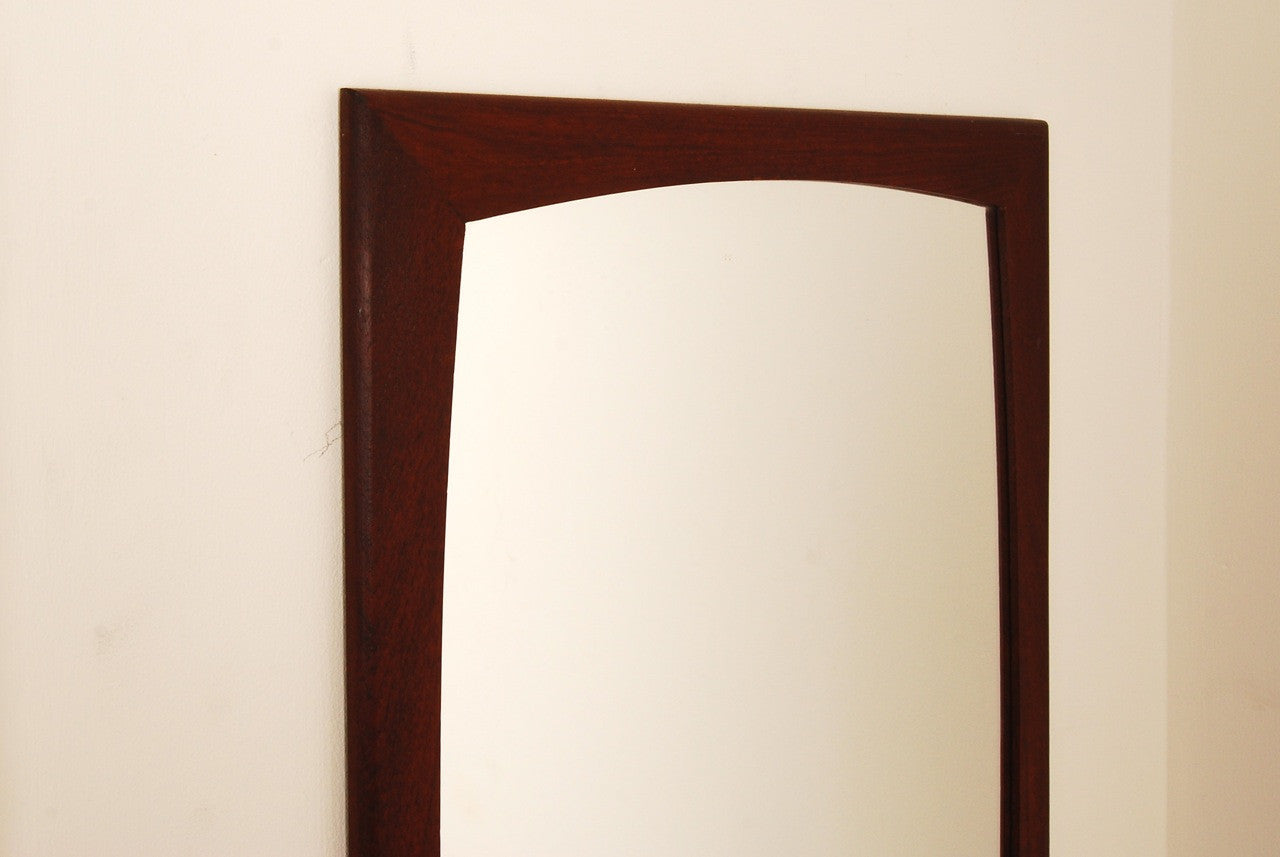 Mirror with curved frame