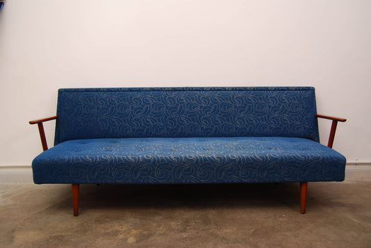 Sofabed with teak arms