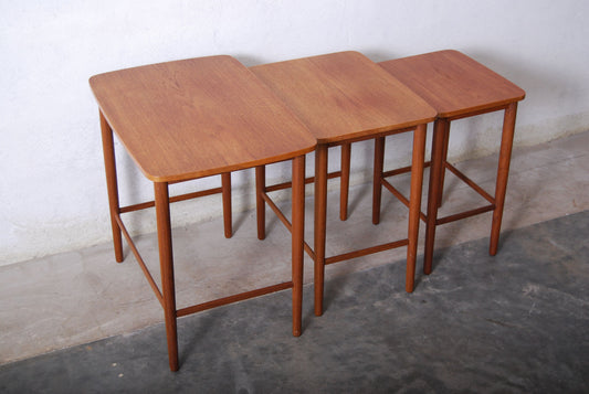 Nest of three tables in teak