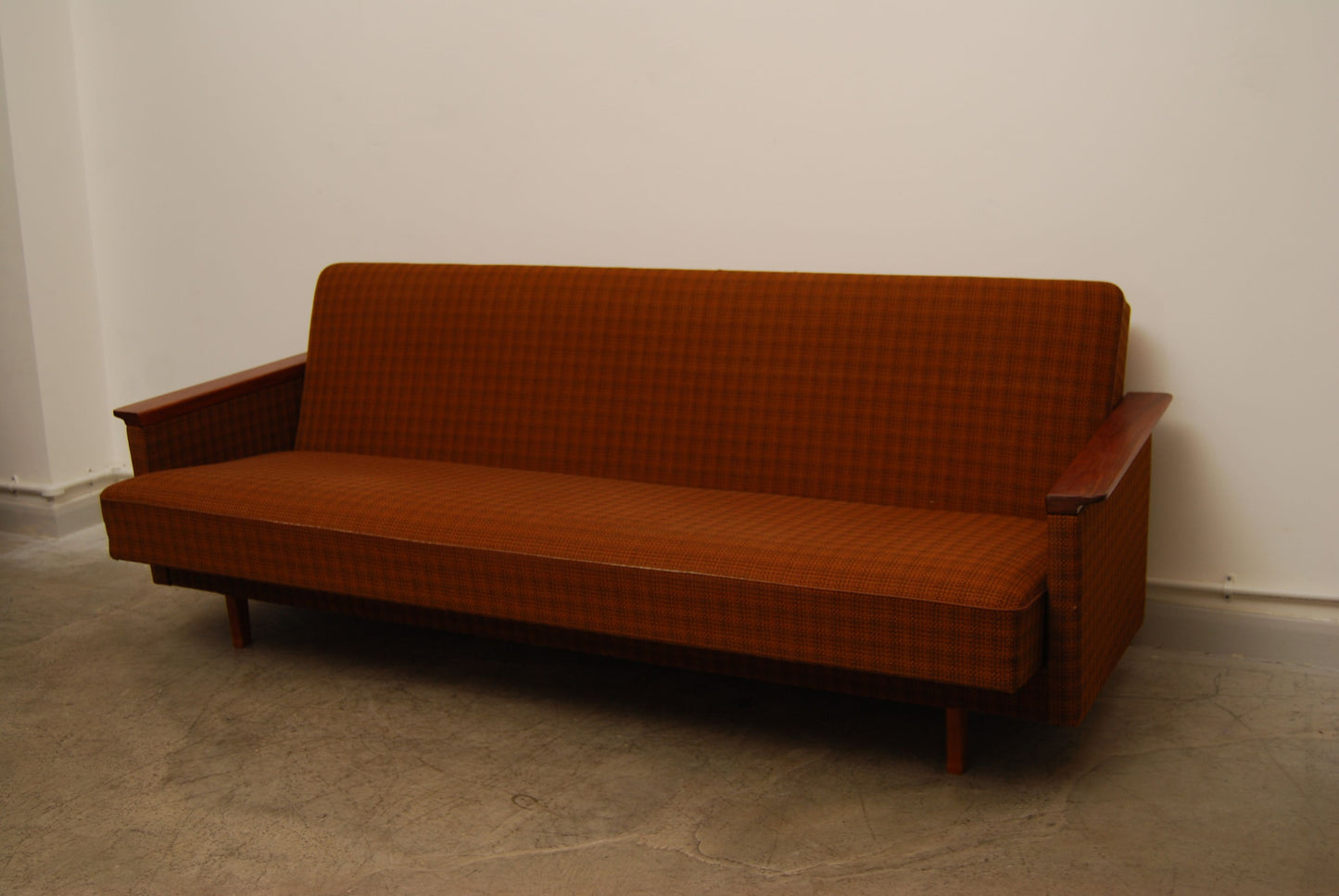 Sofabed with teak arms