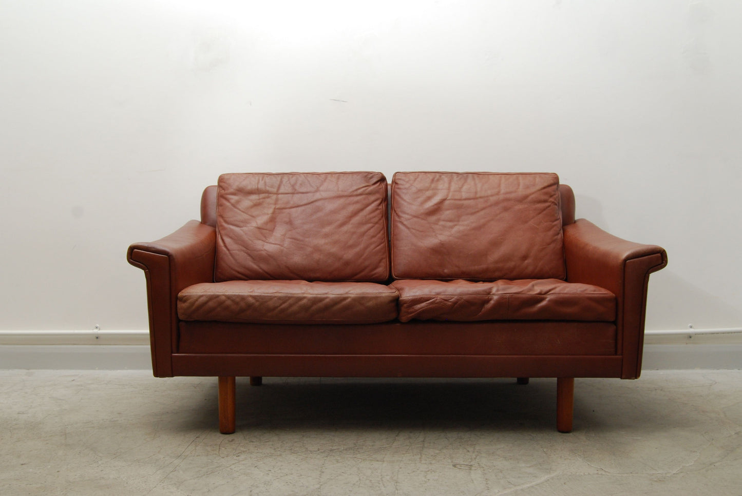 Two seat caramel leather sofa